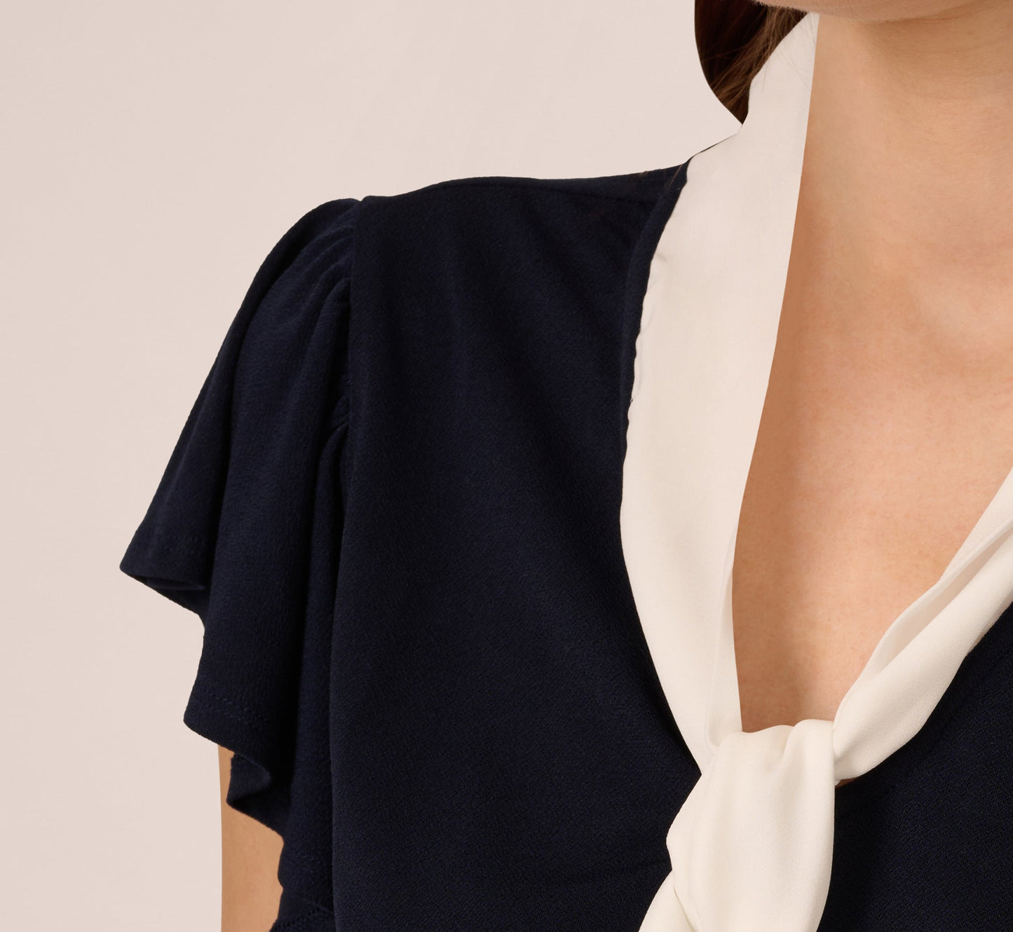 Flutter Sleeve Tie Neck Knit Top In Navy Ivory