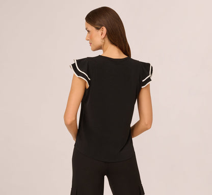 Flutter Sleeve Contrast Tipped Top In Black Ivory
