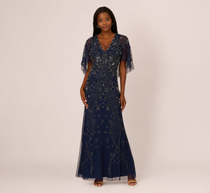 Sequin Beaded Gown With Sheer Cape Sleeves In Light Navy