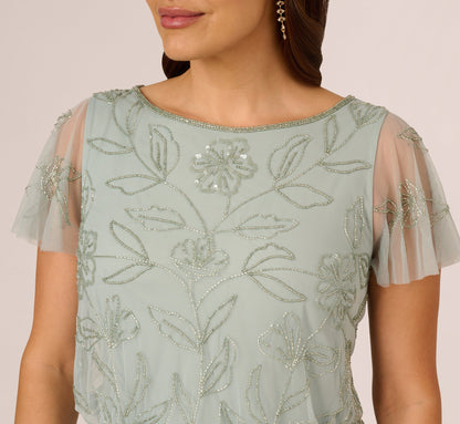 Plus Size Flutter Sleeve Floral Beaded Blouson Gown In Aqua Dust