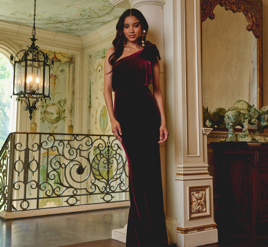 One Shoulder Velvet Bow Gown In Bordeaux