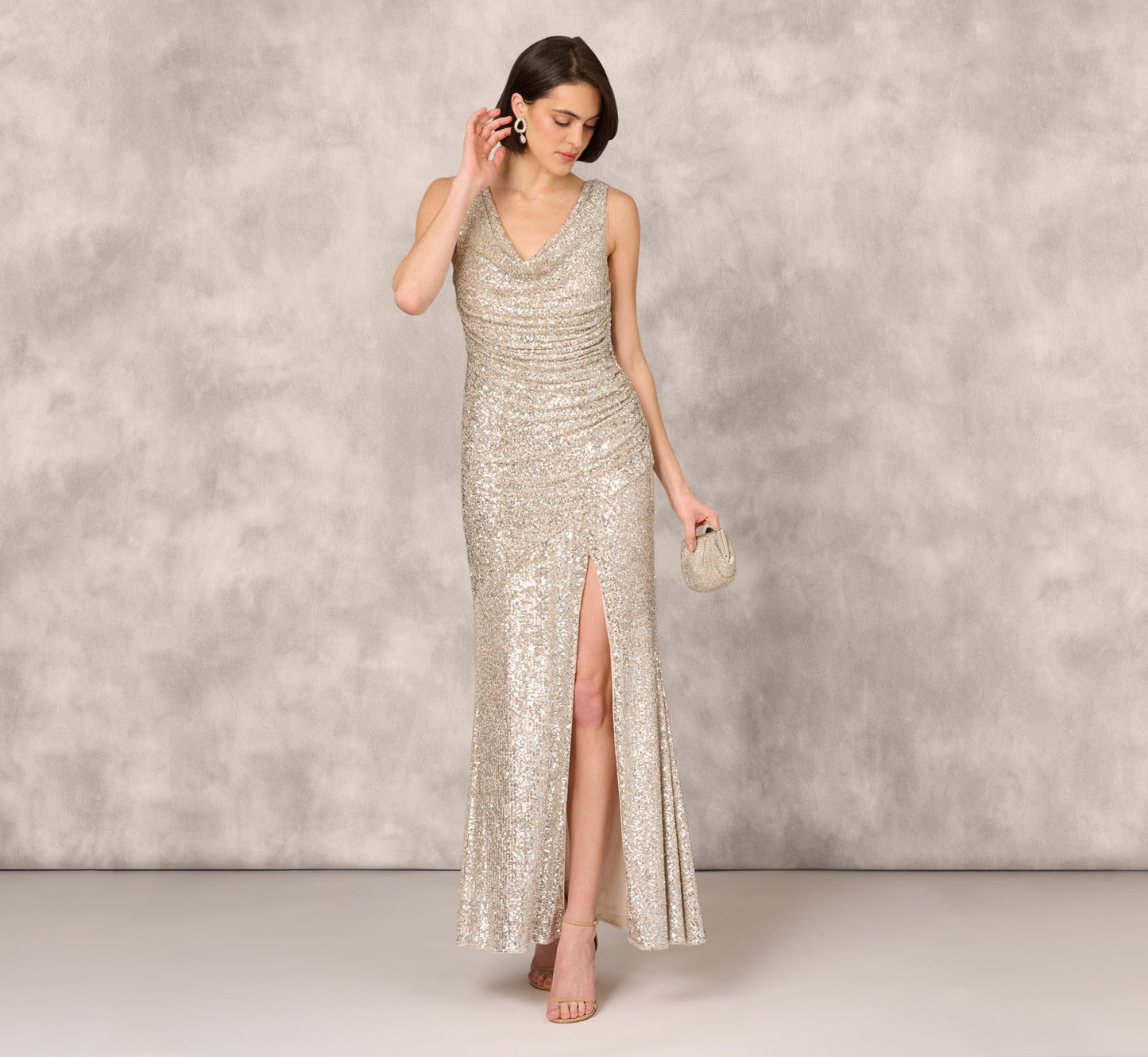 Stretch Sequin Sleeveless Cowl Neck Gown With Gathered Details In Champagne Silver
